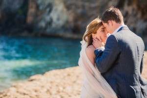 Bride and groom kissing on Amante Beach Ibiza