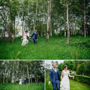 Bride and groom walking through grass