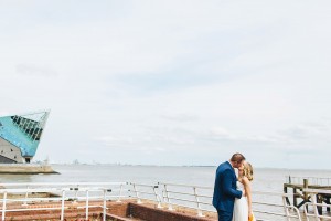 Bride and groom kissing Hull Marina