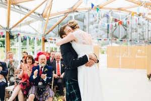 Groom hugging bride wedding ceremony at Alnwick Gardens