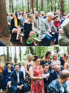 Wedding guests laughing woodland hand fasting wedding