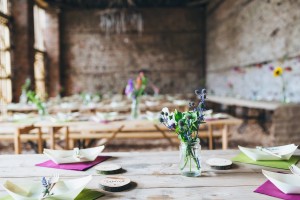 Rustic flowers in jars barn wedding