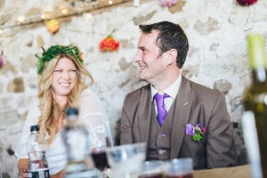 Groom laughing barn wedding Yorkshire