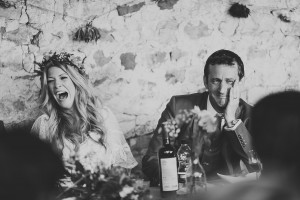 Funny natural photo bride and groom enjoying wedding speeches