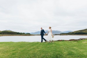 Bride and groom walking Isle of Skye