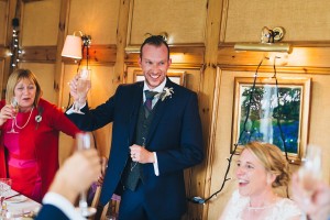 Groom making a toast during wedding speeches