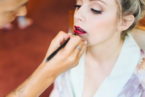 Bride having her lipstick applied