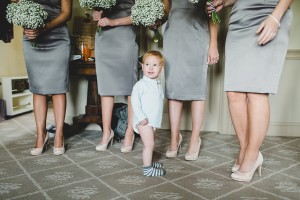 Bridesmaids and pageboy waiting to walk down the aisle