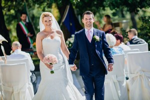 Natural portrait of bride and groom walking