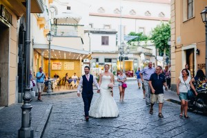 Bride and groom walking through streets of Sorrento