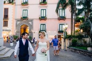 Bride and groom walking through streets of Sorrento, wedding at Villa Fondi