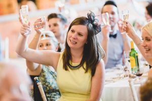 Wedding guest making a toast