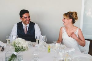 Bride and Groom laughing during Wedding Speeches