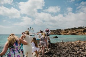 Wedding guests walking to boat, Ibiza