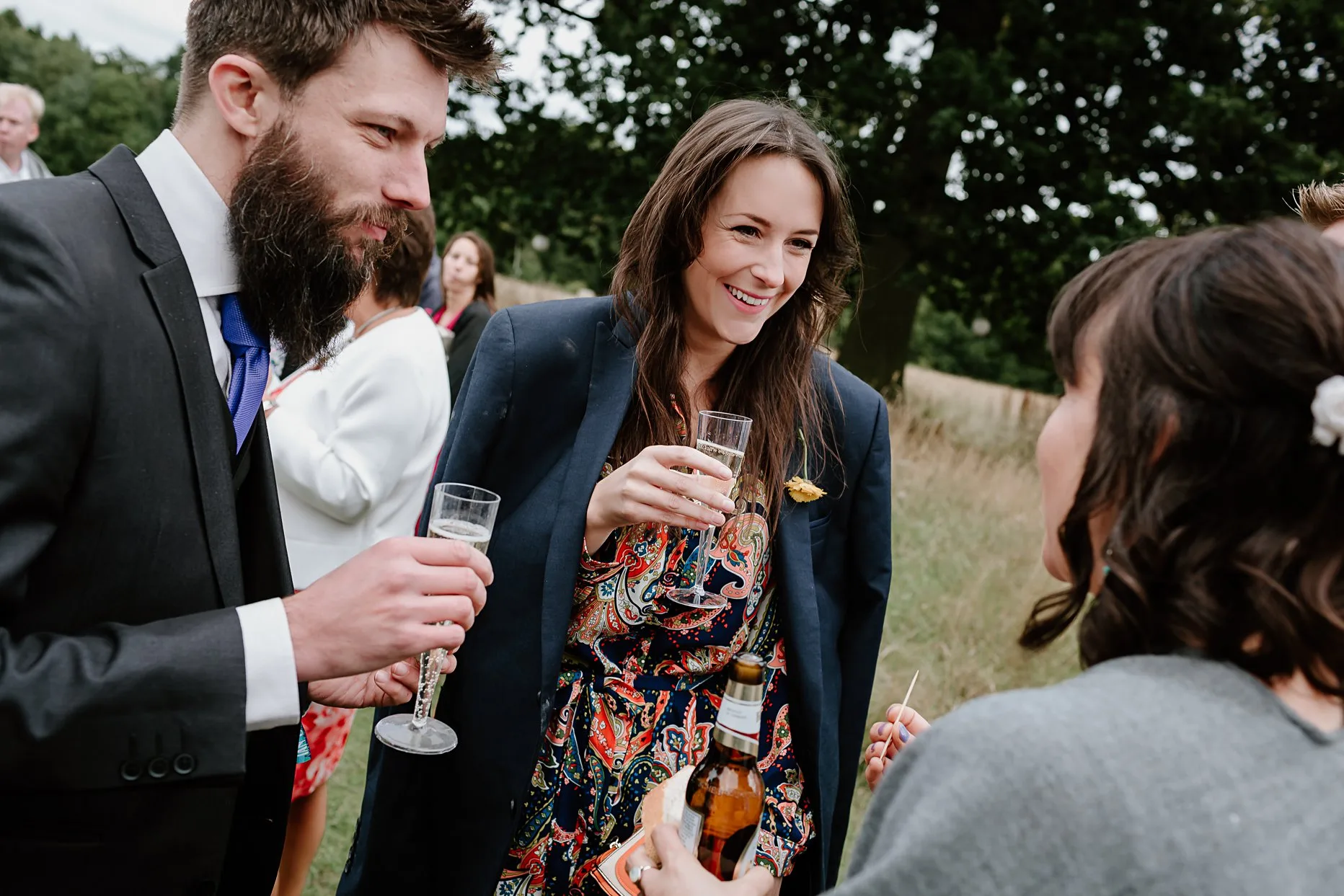 Wedding guests enjoying drinks reception at the meadow in Camp Katur