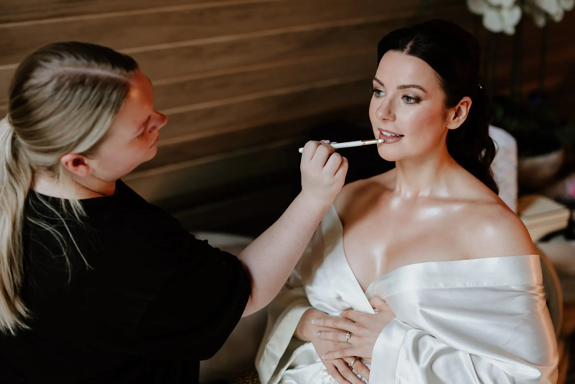 Bride having her make up done the morning of her wedding at Oaklands grand Lodge.